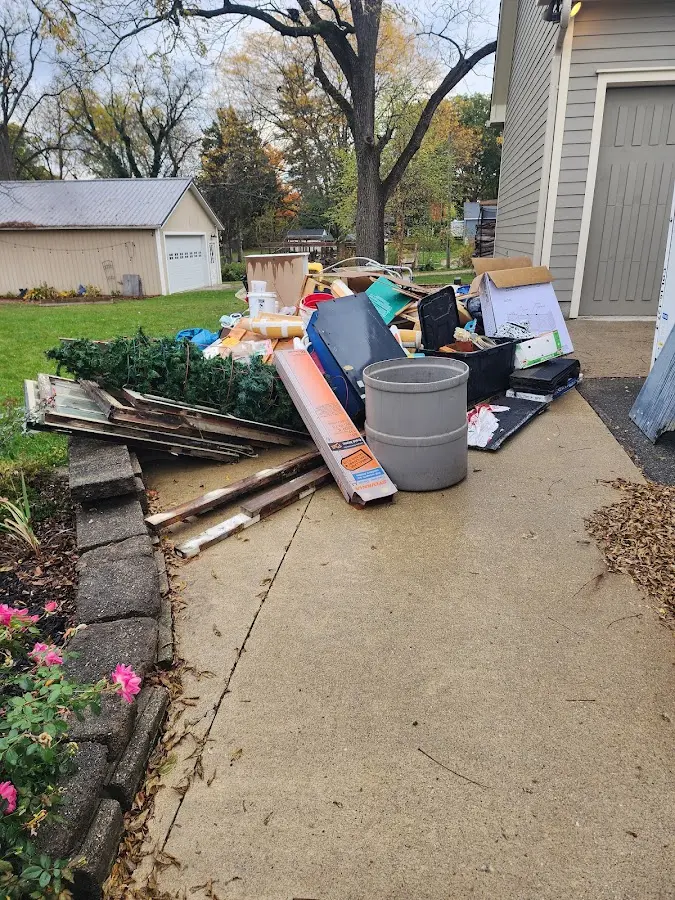 Dumpster being loaded with debris for 3 Yard Dumpster Rental in Columbia Heights